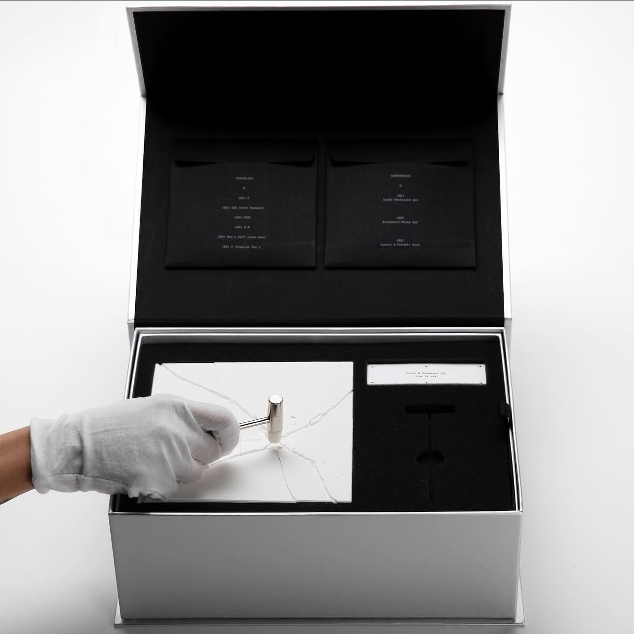 White fractured piece and presentation box, gallery view 3